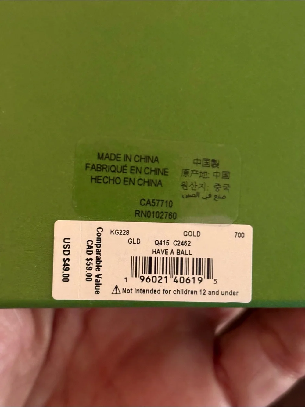 kate spade gold-tone item in lime green box